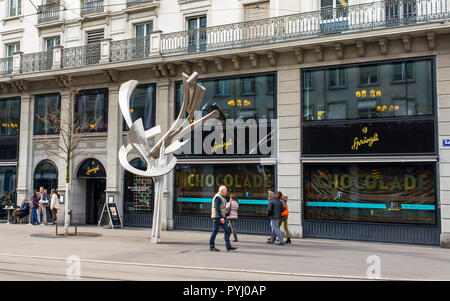 Zurich, Switzerland - March 2017: People walking in front of Confiserie Sprüngli, a Swiss luxury confectionery chocolat shop  manufacturer founded in  Stock Photo