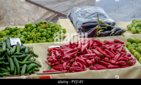 Red and Green Chillies along with Eggplants at Turkey Market Stock Photo