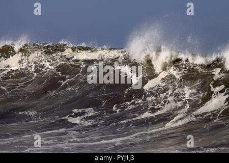 Detailed big wave on the Portuguese coast in a sunny but stormy autumn morning Stock Photo