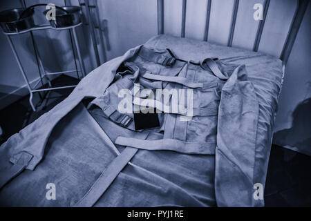 Old psychiatric straitjacket, mental hospital detail, psychosis Stock Photo