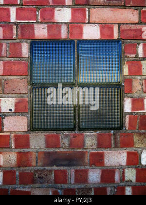 Old Arched window now bricked up and now has 4 square Glass Bricks in Bawtry South Yorkshire England Stock Photo