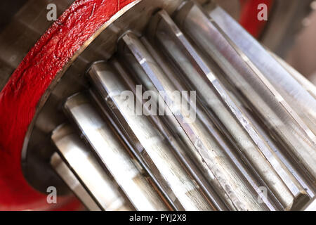 cogwheel of a helical gear in a gearbox, detail of the teeth with a red mark Stock Photo