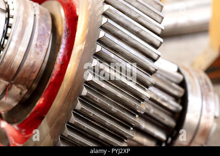 cogwheel of a helical gear in a gearbox, detail of the teeth with the bearings Stock Photo