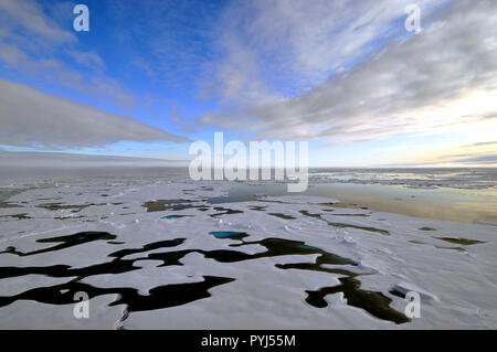 The clouds begin to thin over the Arctic Ocean Aug. 19, 2009. Stock Photo