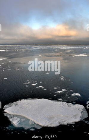 The clouds begin to thin over the Arctic Ocean Sept. 9, 2009. Stock Photo