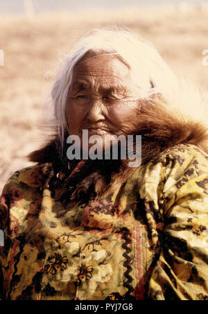 Early 1970s elderly Eskimo woman from the Kotzebue Sound region wearing ...