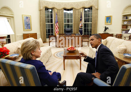 President Barack Obama meets with Secretary of State Hillary Clinton in the Oval Office shortly after she was confirmed and sworn in on Wednesday, Jan. 21, 2009. Stock Photo
