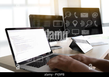 man work Coding software developer programmer is coding on a desktop computer Stock Photo