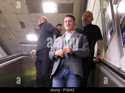 Tommy Robinson surrounded by supporters outside City Thameslink railway station, after the former English Defence League (EDL) leader left the Old Bailey where his contempt of court case was adjourned.  Featuring: Tommy Robinson Where: London, United Kingdom When: 27 Sep 2018 Credit: Danny Martindale/WENN Stock Photo