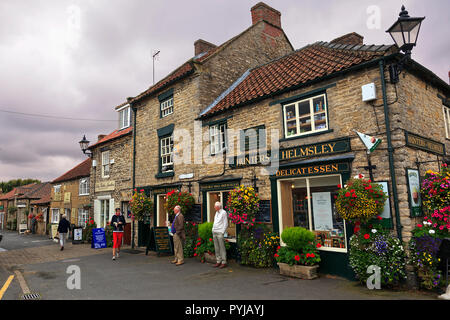 Colourful floral display on Delicatessen Shop in Boro Gate, Helmsley, North Yorkshire UK Stock Photo