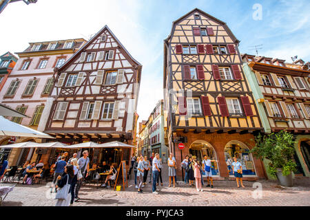 COLMAR, FRANCE - September 10, 2017: Cityscaspe view on the old town with beautiful half-timbered houses and crowded streets in Colmar, famous french town in Alsace region Stock Photo