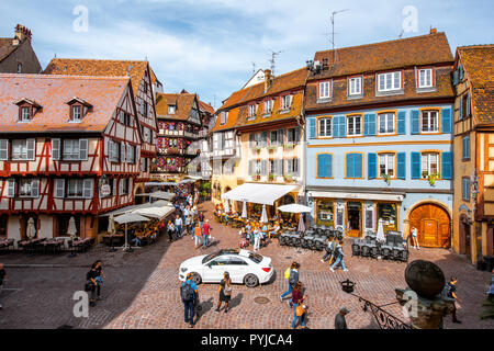 COLMAR, FRANCE - September 10, 2017: Cityscaspe view on the old town with beautiful half-timbered houses and crowded streets in Colmar, famous french town in Alsace region Stock Photo