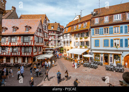 COLMAR, FRANCE - September 10, 2017: Cityscaspe view on the old town with beautiful half-timbered houses and crowded streets in Colmar, famous french town in Alsace region Stock Photo