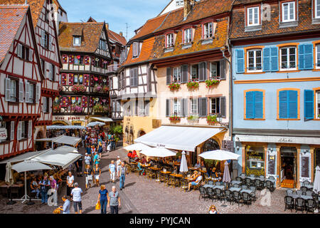 COLMAR, FRANCE - September 10, 2017: Cityscaspe view on the old town with beautiful half-timbered houses and crowded streets in Colmar, famous french town in Alsace region Stock Photo