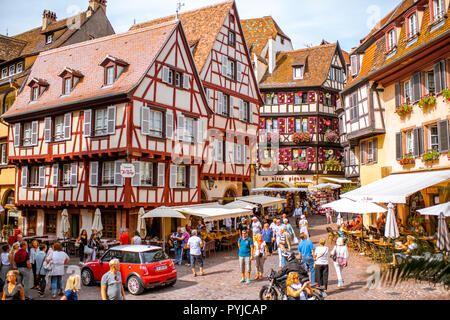 COLMAR, FRANCE - September 10, 2017: Cityscaspe view on the old town with beautiful half-timbered houses and crowded streets in Colmar, famous french town in Alsace region Stock Photo