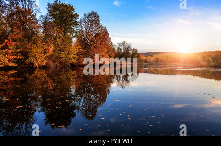 Autumn landscape with lake in the forest. Autumn forest. Stock Photo