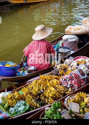 Damnoen Saduak Floating Market, Thailand:- April 12, 2018:- This is a floating Market in Thailand and take a boat then have a great tour at Floating M Stock Photo