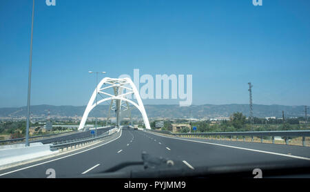 Cordoba, Spain - 2018 july 10th: Driving by Ibn Abbas Firnas Bridge close to Cordoba City. View from the inside of the car. Designed by JL Manzanares  Stock Photo