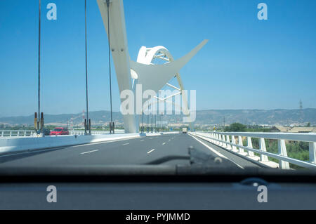 Cordoba, Spain - 2018 july 10th: Driving by Ibn Abbas Firnas Bridge close to Cordoba City. View from the inside of the car. Designed by JL Manzanares  Stock Photo