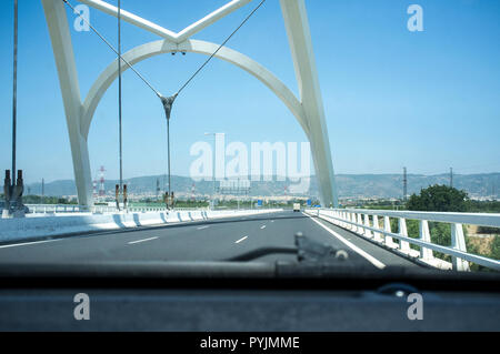 Cordoba, Spain - 2018 july 10th: Driving by Ibn Abbas Firnas Bridge close to Cordoba City. View from the inside of the car. Designed by JL Manzanares  Stock Photo