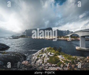 The stunning Hamnoy bridge in Lofoten Islands, Norway seen from a drone aerial. The bridge connects the village of Reine with the village of Hamnoy. P Stock Photo