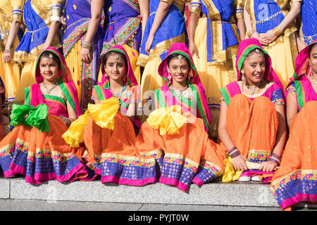 London UK. 28th October 2018. Indian performers of the Mass Ghoomar dance  in traditional costumes pose at the Diwali festival in Trafalgar Square Diwali  traditionally symbolises joy, love, reflection, resolution, forgiveness, light and knowledge and represents the victory of good over evil, and light over darkness Credit: amer ghazzal/Alamy Live News Stock Photo