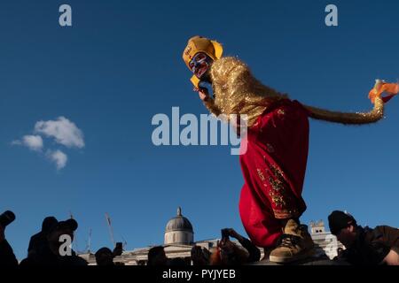 London, UK. 28 October 2018, Indian Diwali Festival Celebrated in  London, Two man with monkey costume were performing as part of Diwali festival in Trafalgar Square Credit: Emin Ozkan/Alamy Live News Stock Photo