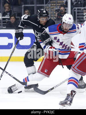 Los Angeles, California, USA. 28th Oct, 2018. Los Angeles Kings forward Alex Iafallo (19) and New York Rangers' forwrad Mika Zibanejad (93) vie for the puck during the first period of a preseason NHL hockey game Tuesday, Oct. 28, 2018, in Los Angeles. Credit: Ringo Chiu/ZUMA Wire/Alamy Live News Stock Photo