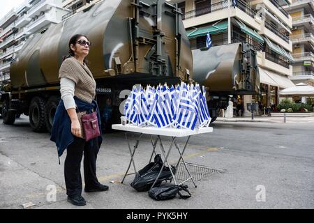 Thessaloniki, Greece. 28th Oct, 2018. A vendor is seen selling plastic Greek flags for the military parade of the WWII Anniversary of No during the preparations.The Greek military prepares for the annual military parade for celebrating Greece's National 'Oxi' (No) Day, commemorating Greece's refusal to accept the ultimatum advanced by fascist Italy in 1940 during World War II. Credit: Giorgos Zachos/SOPA Images/ZUMA Wire/Alamy Live News Stock Photo
