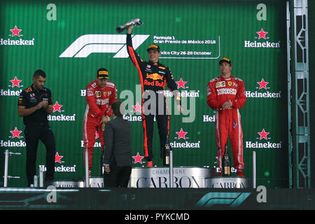 Mexico City, Ferrari's German driver Sebastian Vettel (2nd L) and Ferrari's Finnish driver Kimi Raikkonen (1st R) react on the podium during the Mexican Formula One Grand Prix at Hermanos Rodriguez racetrack in Mexico City. 28th Oct, 2018. Red Bull's Dutch driver Max Verstappen (2nd R), Ferrari's German driver Sebastian Vettel (2nd L) and Ferrari's Finnish driver Kimi Raikkonen (1st R) react on the podium during the Mexican Formula One Grand Prix at Hermanos Rodriguez racetrack in Mexico City, Mexico on Oct. 28, 2018. Credit: Xin Yuewei/Xinhua/Alamy Live News Stock Photo