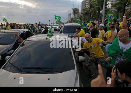 Recife, Brazil. 28th Oct, 2018. Supporters of the extreme right-wing presidential candidate Bolsonaro cheer in Rio de Janeiro. The right-wing populist has won the presidential election in Brazil. Credit: Fabio Teixeira/dpa/Alamy Live News Stock Photo