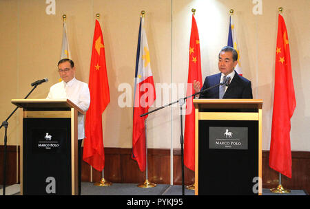 Davao, Philippines. 29th Oct, 2018. Chinese State Councilor and Foreign Minister Wang Yi (R) and Philippine Foreign Affairs Secretary Teodoro Locsin attend a joint press conference in Davao, the Philippines, Oct. 29, 2018. Credit: Rouelle Umali/Xinhua/Alamy Live News Stock Photo