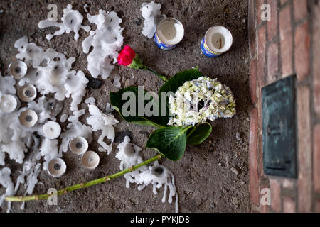 Vigil candles seen on the floor. After the tragic shooting in Pittsburgh, PA at the Tree of Life. Community gathers from all different races and religions.  Many have driven and flown many hours to get there to show support. Stock Photo