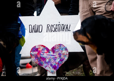 A temporary graves with the name David Rosenthal writting on it. After the tragic shooting in Pittsburgh, PA at the Tree of Life. Community gathers from all different races and religions.  Many have driven and flown many hours to get there to show support. Stock Photo