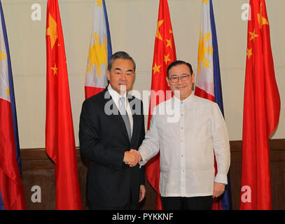 Davao, Philippines. 29th Oct, 2018. Chinese State Councilor and Foreign Minister Wang Yi (L) meets with Philippine Foreign Affairs Secretary Teodoro Locsin in Davao, the Philippines, Oct. 29, 2018. Credit: Rouelle Umali/Xinhua/Alamy Live News Stock Photo