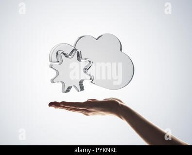 Cloud computing concept with glass symbol shown in hand Stock Photo