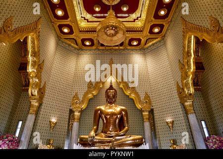 Statue Of Buddha Made Of Pure Gold Surrounded By Flowers And Offerings ...