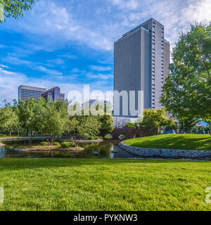 City Creek Park with bridge buildings and trees Stock Photo