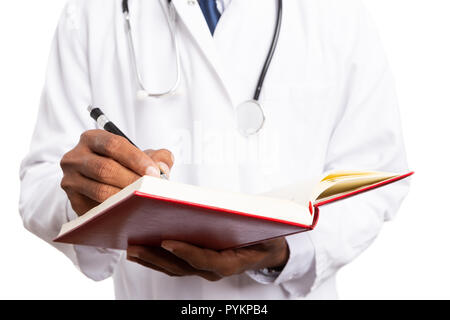 Close-up of doctor using pen to write in notebook isolated on white background Stock Photo