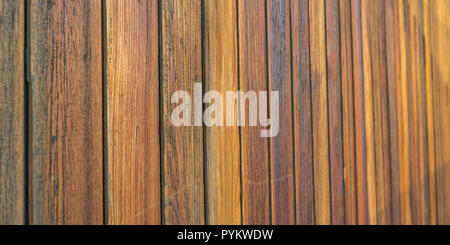 Wooden wall made of brown horizontal planks Stock Photo