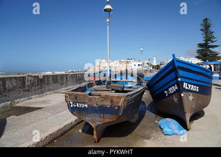 Two blue wooden fishing boats in front of the medina , Essaouira, Morocco Stock Photo