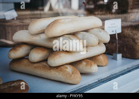Fresh white baguettes stacked on sale at Borough Market, London, UK. Stock Photo