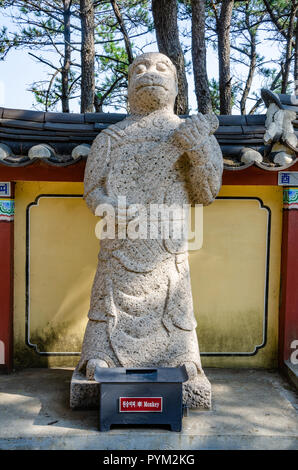 Stone sculpture representing the monkey deity from the Chinses Zodiac, seen here at Haedong Yonggung Temple, Busan, South Korea. Stock Photo
