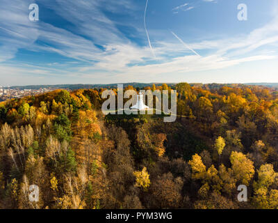 Aerial view of the Three Crosses monument overlooking Vilnius Old Town on sunset. Vilnius landscape from the Hill of Three Crosses, located in Kalnai  Stock Photo