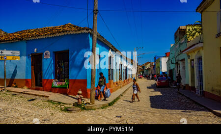 TRINIDAD, CUBA - MAY 25, 2014: Unidentified people on the street of Trinidad, Cuba. Trinidad has been a UNESCO World Heritage site since 1988. Stock Photo