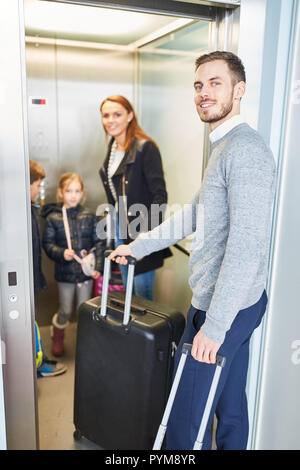 Family at airport on way to holiday, Copenhagen, Denmark ...