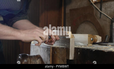 close up, carpenter makes a hole by using tip turning loving Stock Photo