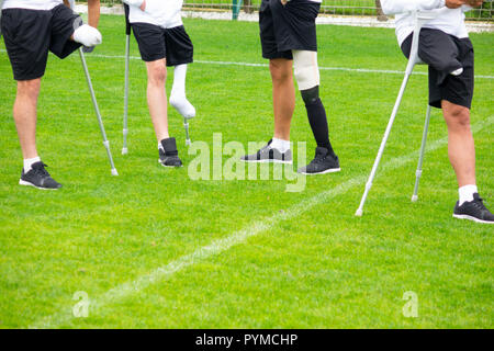 close-up of ampute soccer player and team friends Stock Photo