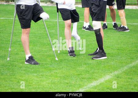 close-up of ampute soccer player and team friend Stock Photo