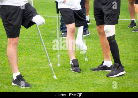 close-up of ampute soccer player and team friends Stock Photo